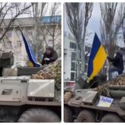 Український поліцейський з національним прапором на ходу застрибнув на ворожий БТР