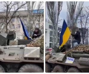 Український поліцейський з національним прапором на ходу застрибнув на ворожий БТР